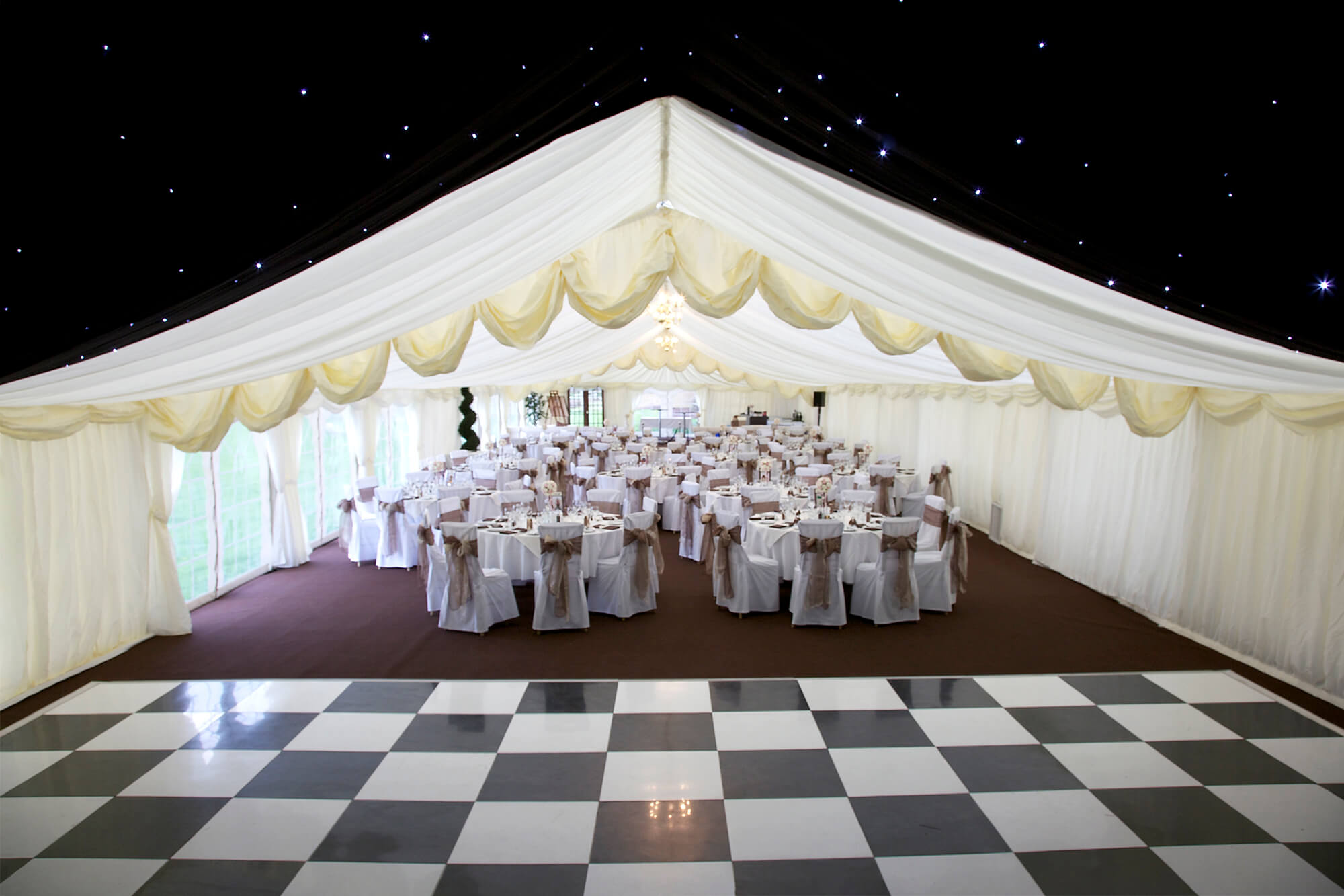 Chair Covers in Marquee with Dance Floor Hired for Wedding